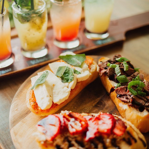 Bruschetta flight and a cocktail