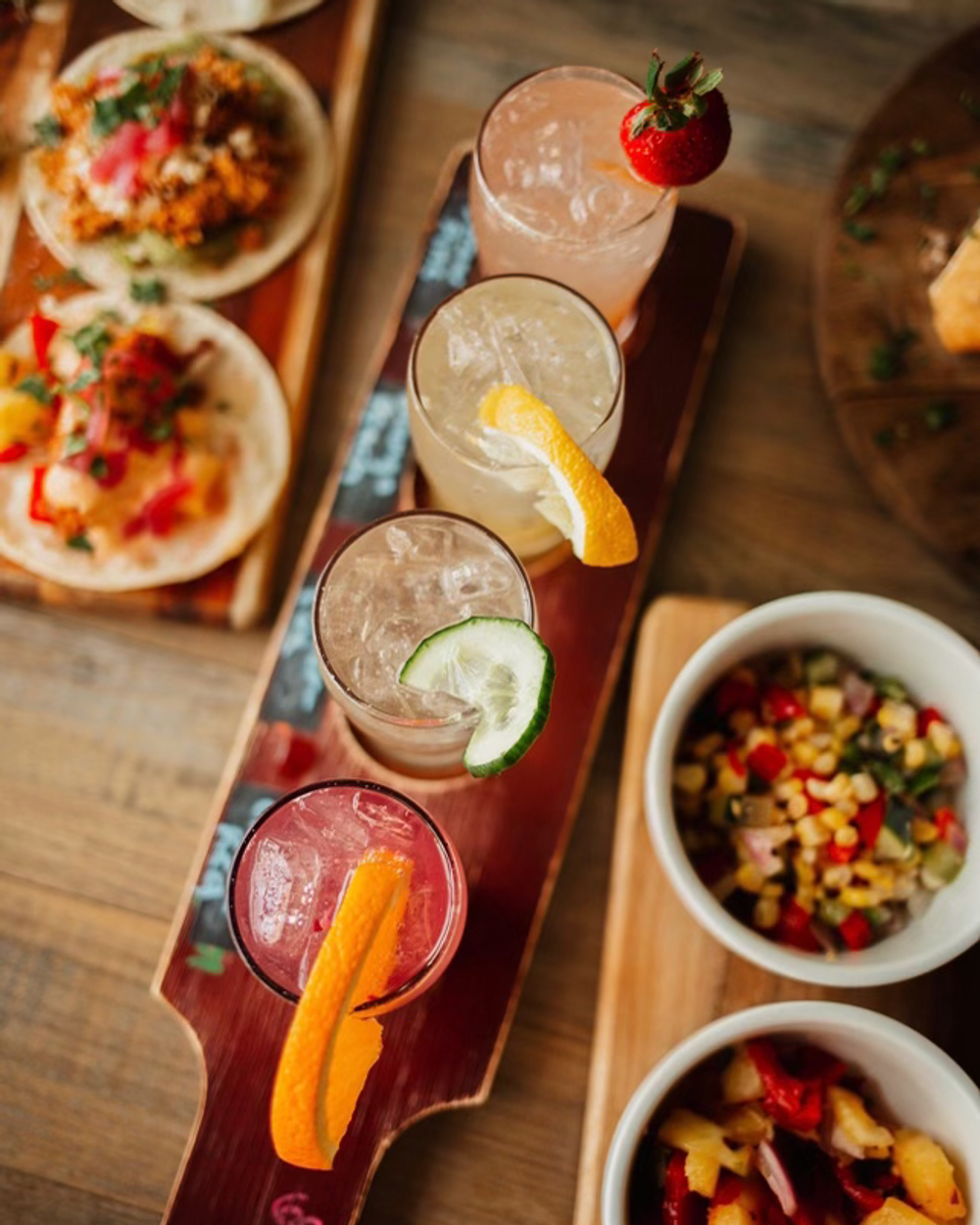 Cocktail flight on a wooden paddle at Blackstone Coventry