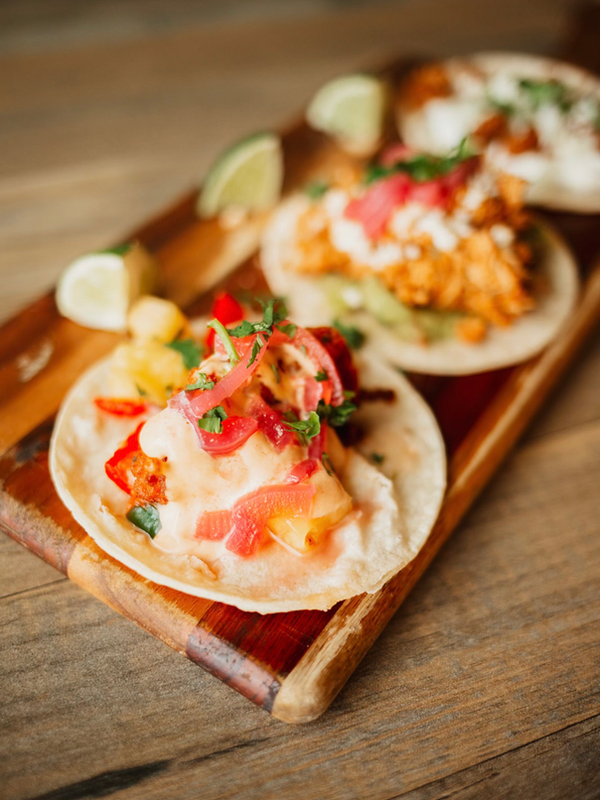 Taco flight, three tacos on a board